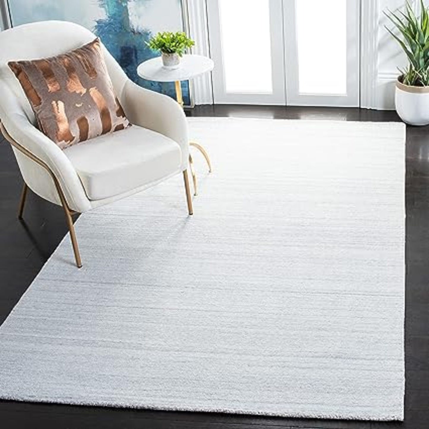 Alfombra Americana marca Safavieh hecha a mano en color Gris claro